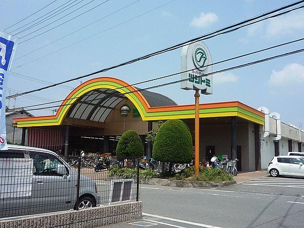 【周辺】スーパーツジトミ交野店（1217m）